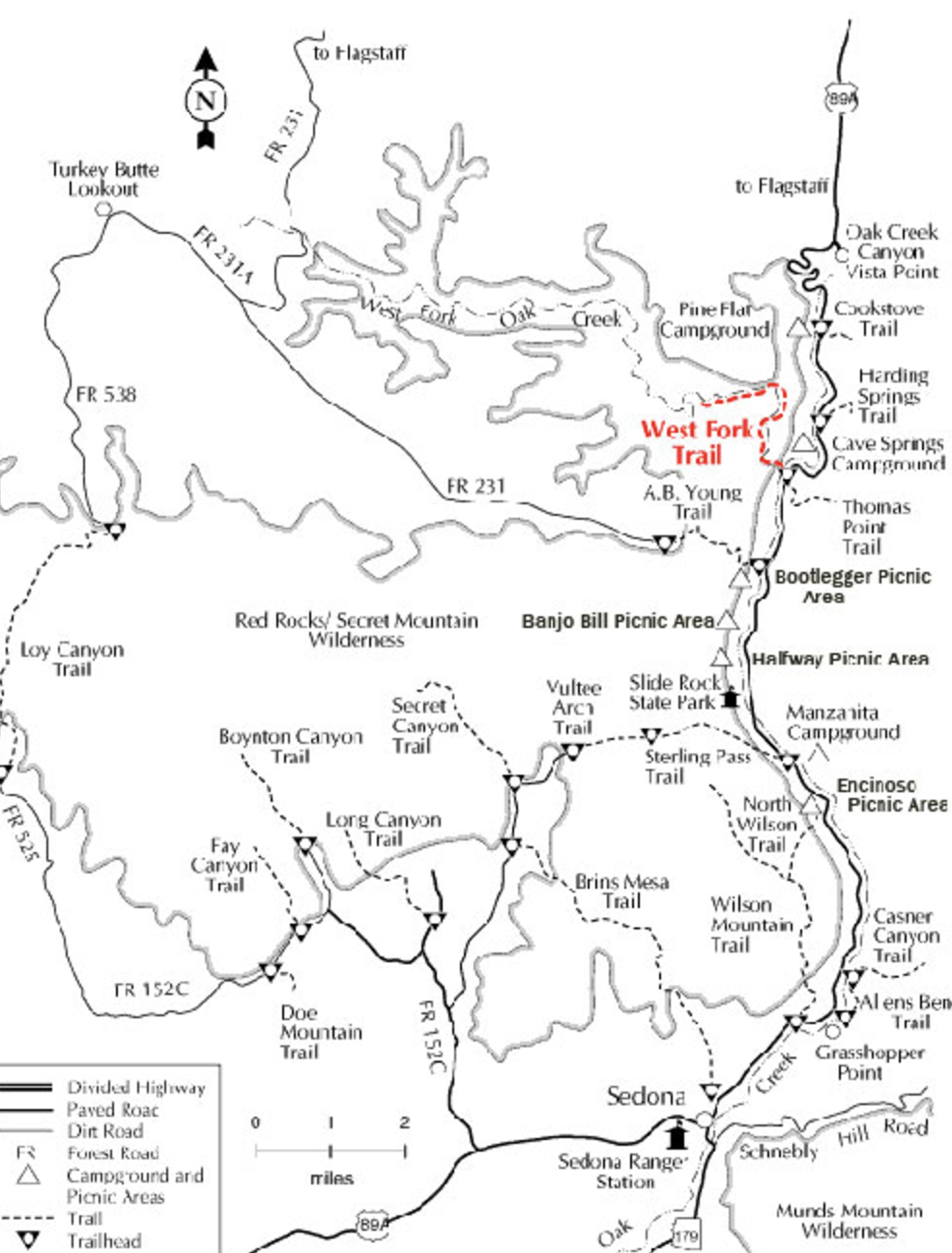 Map of hiking trails near Sedona, Arizona, showing divided highways, paved and dirt roads, forest roads, campgrounds, and picnic areas. West Fork Trail highlighted.